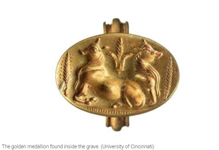The golden medallion found inside the grave. (University of Cincinnati)