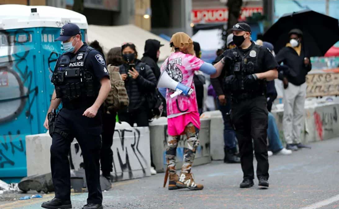 About 59 officers were injured during the disturbances last weekend in Seattle, local police said they detained 45 people.