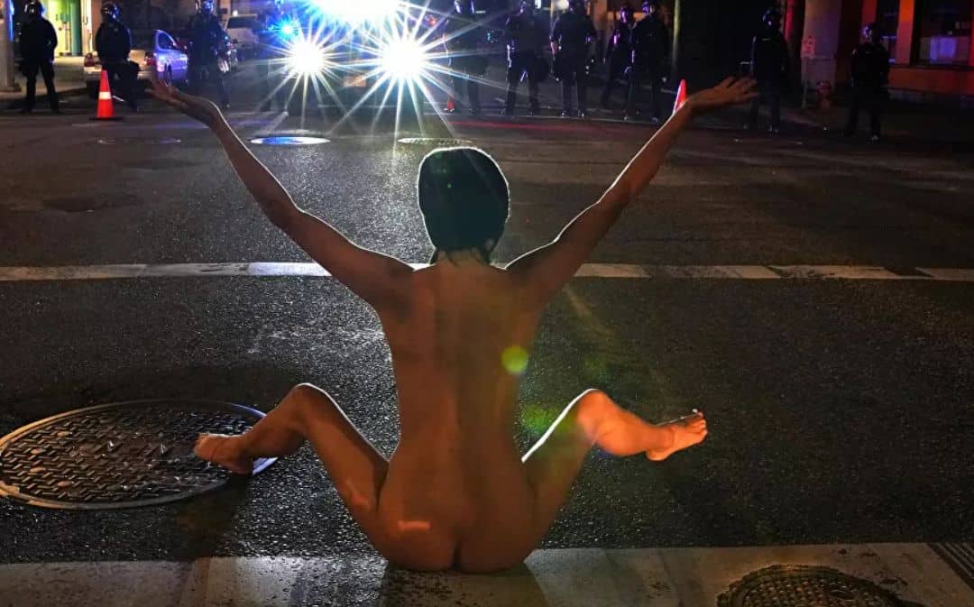 Who is the 'Naked Athena', the mysterious woman who confronted the Police in a US protest?