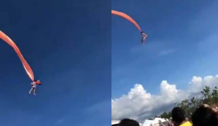 A kite catches a three-year-old girl and shakes her in the air several metres from the ground