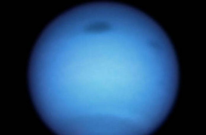 A dark vortex on Neptune changes direction and dodges 
