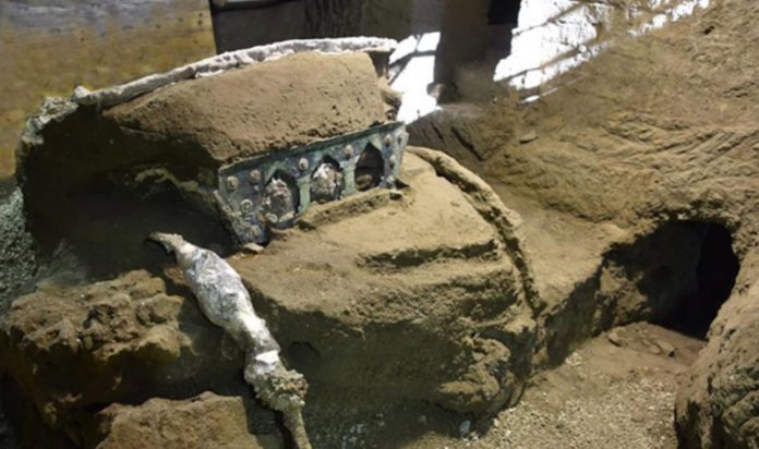 A large almost intact ceremonial chariot discovered in Pompeii