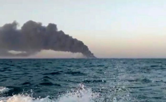 Iran's biggest navy ship catches fire and sinks after being engulfed in huge flames
