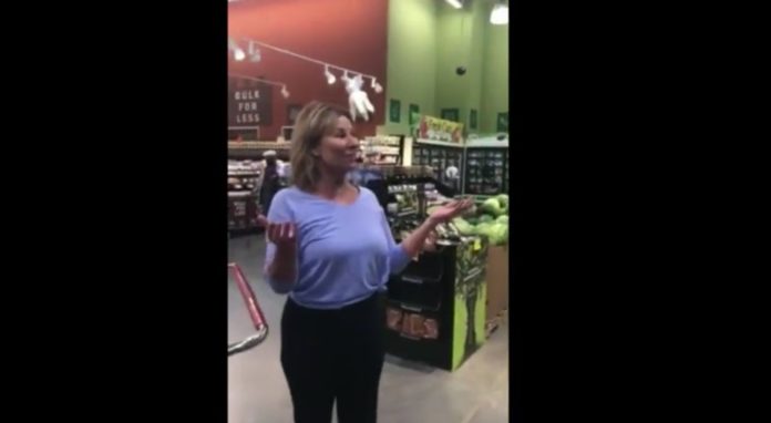 Maskless woman caught on tape purposefully coughing on people at grocery store