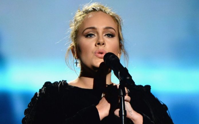 Adele hopes her new album will help son Angelo understand why she divorced his dad