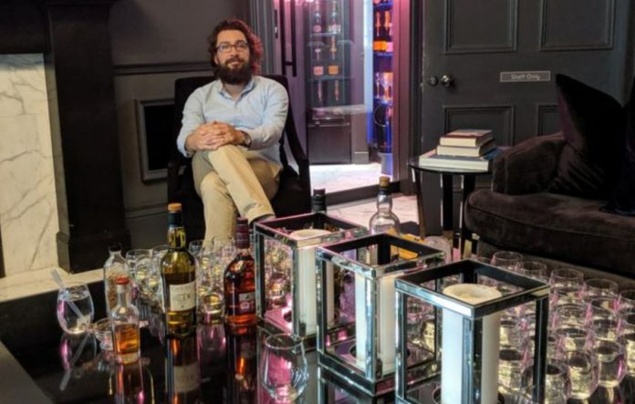 Whiskey expert, terrified of losing his sense of smell and taste, continues to live in isolation
