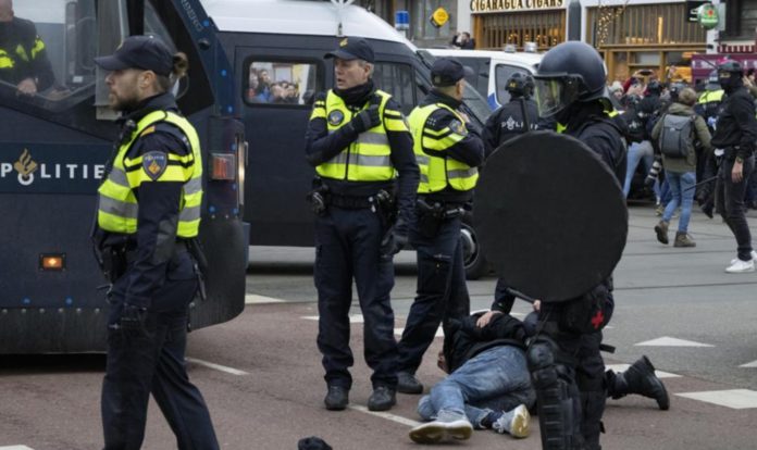 COVID protests in Amsterdam devolve into violence, police detain 30 people