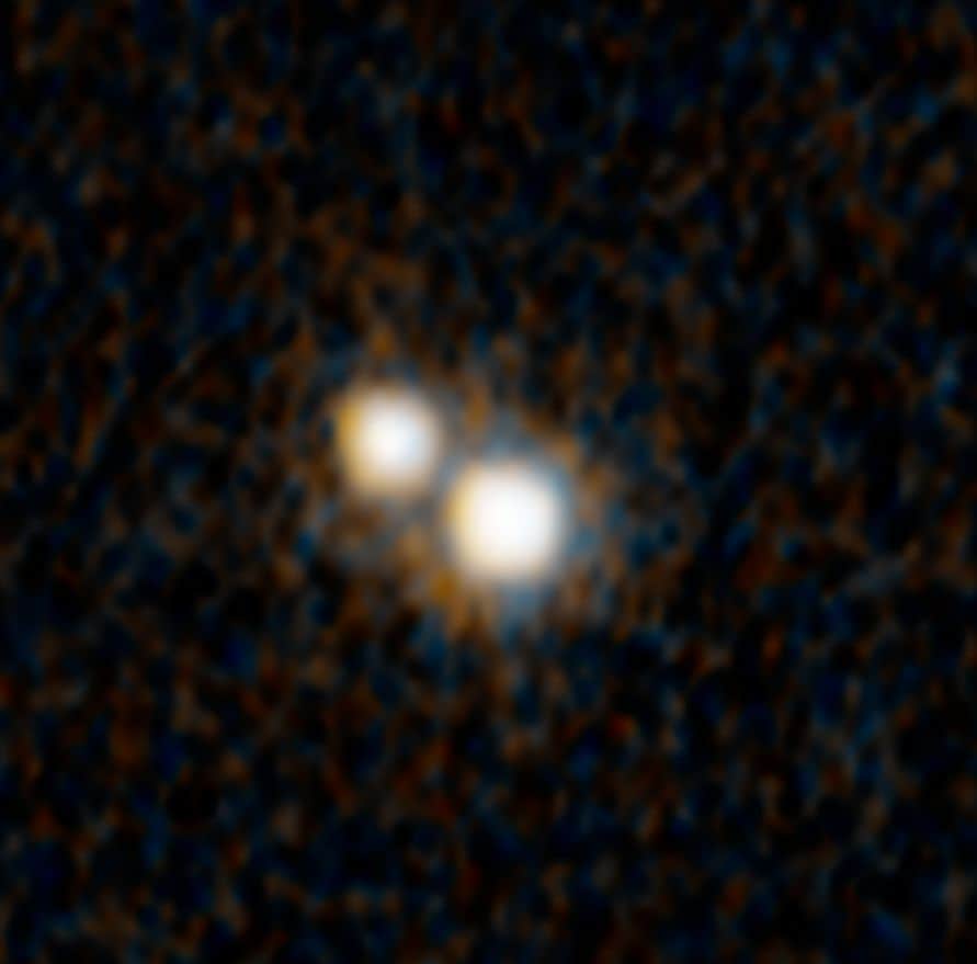 Astronomers Discover Rare Pair of Quasars in Merging Galaxies from Early Universe